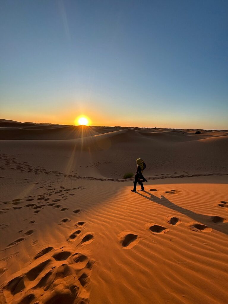 watching the sunset in the desert during our Morocco tout